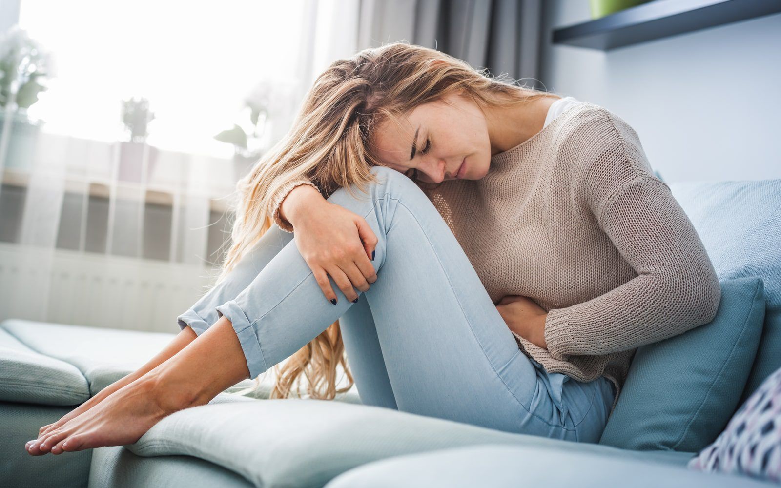 Woman suffering from PMS Symptoms