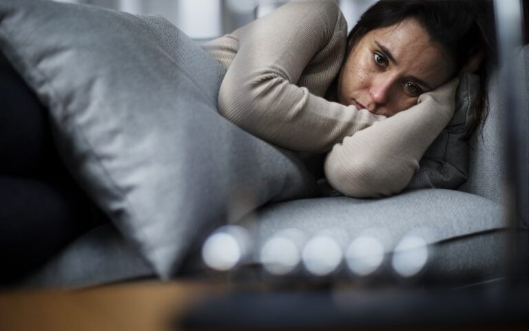 Woman depressed in bed