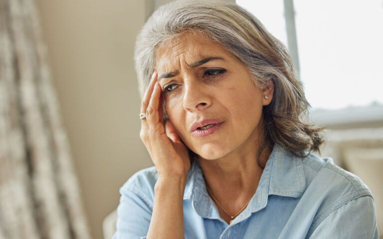 Woman Experiencing Memory Loss and Forgetfulness